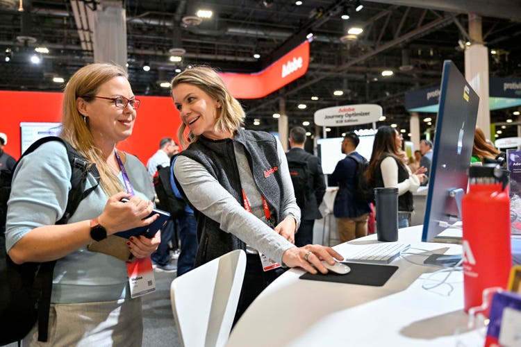 Adobe Summit – Teo people at a product booth image