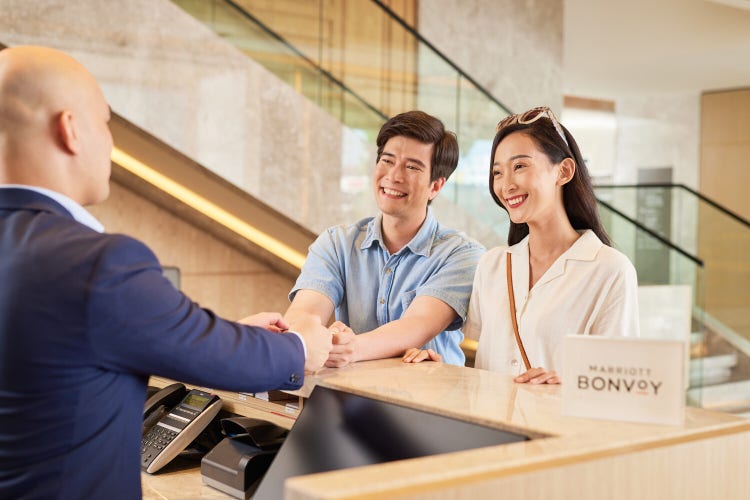 Adobe and Marriott – Couple at reception desk