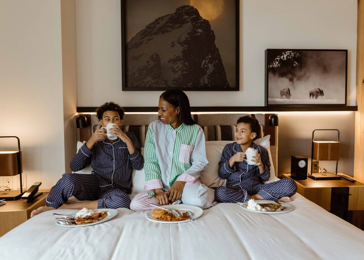 Adobe and Marriott – Family lounging on hotel bed